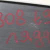 Обшивка кришки багажника центральна 9801240777